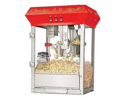 Red popcorn machine filled with freshly popped popcorn